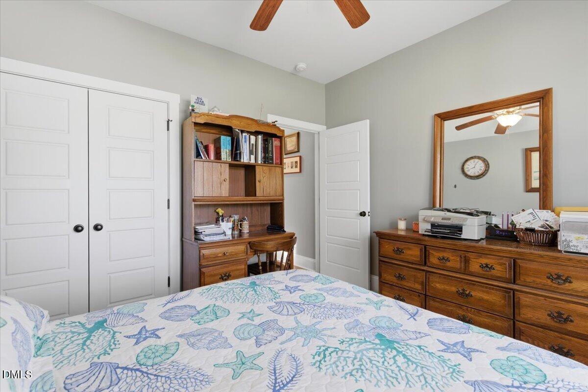 111 West Huckleberry Way Rocky Point, NC 28457 - Photo 56 of 72 a bedroom with a bed and a dresser