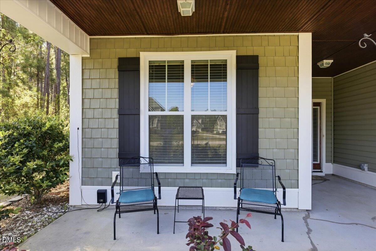 111 West Huckleberry Way Rocky Point, NC 28457 - Photo 9 of 72 a view of a bench in front of house