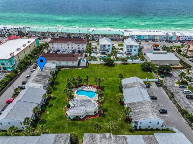 an aerial view of a house with a garden
