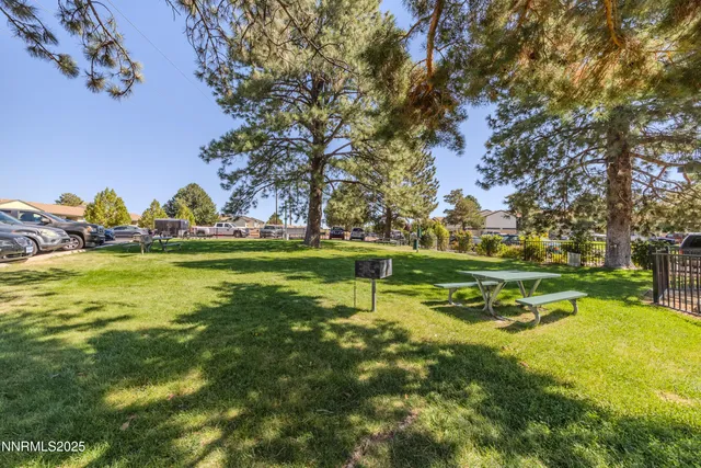 a view of swimming pool with outdoor seating and yard