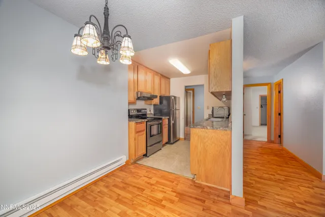 a view of a kitchen from the hallway