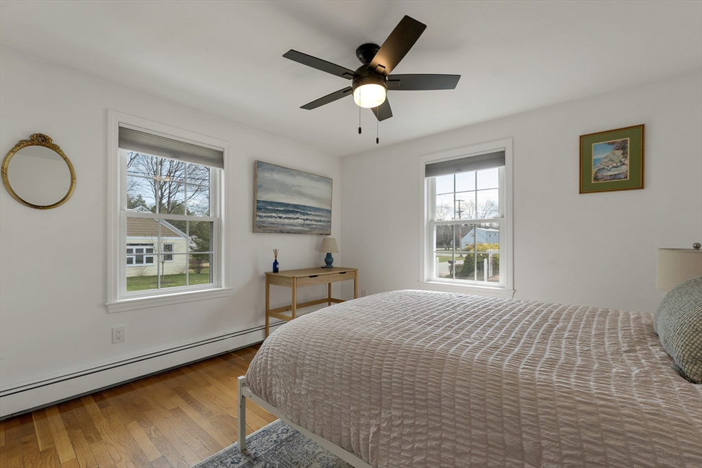 8 Norton Road Hampton, NH 03842 - Photo 15 of 42 a bedroom with a bed and a window