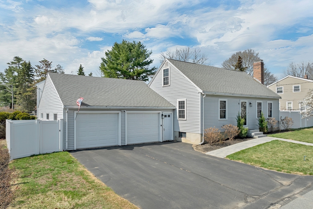 8 Norton Road Hampton, NH 03842 - Photo 22 of 42 front view of a house with a yard