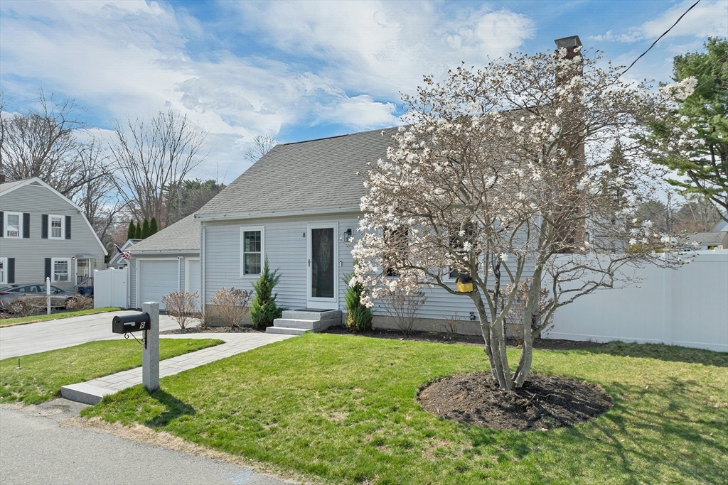 8 Norton Road Hampton, NH 03842 - Photo 25 of 42 a front view of a house with garden