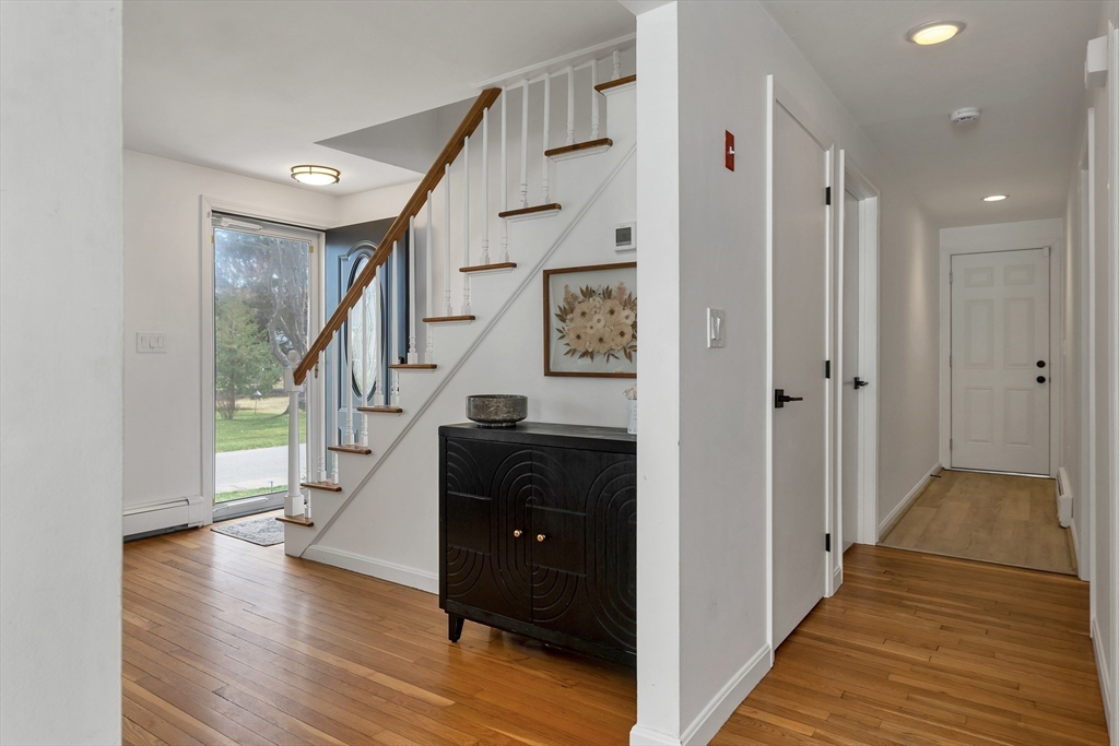 8 Norton Road Hampton, NH 03842 - Photo 26 of 42 a view of entryway with wooden floor and stairs