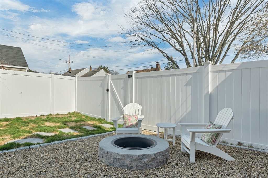 8 Norton Road Hampton, NH 03842 - Photo 36 of 42 a view of a backyard with table and chairs