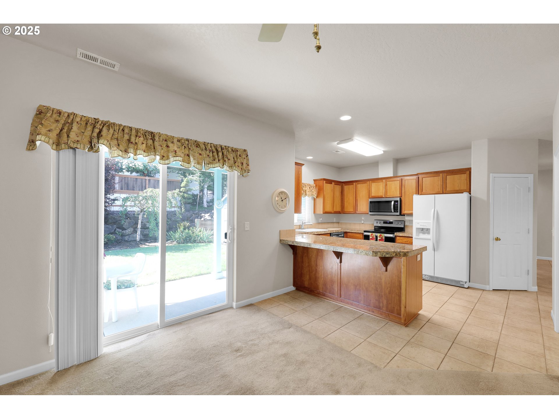88075 9th Street Veneta, OR 97487 - Photo 13 of 45 a kitchen with stainless steel appliances granite countertop a stove a sink and a refrigerator