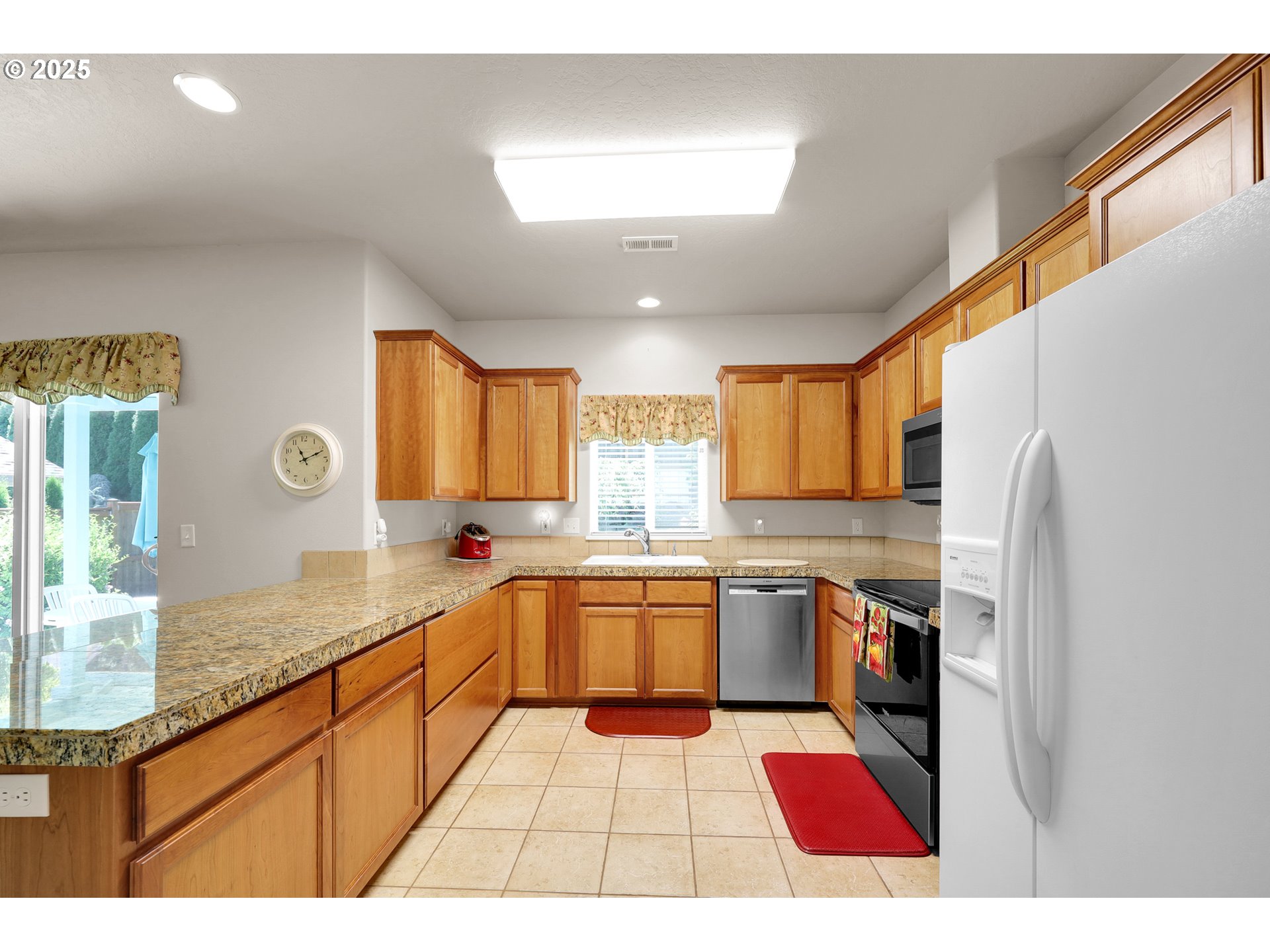88075 9th Street Veneta, OR 97487 - Photo 16 of 45 a kitchen with a sink a stove a refrigerator and cabinets