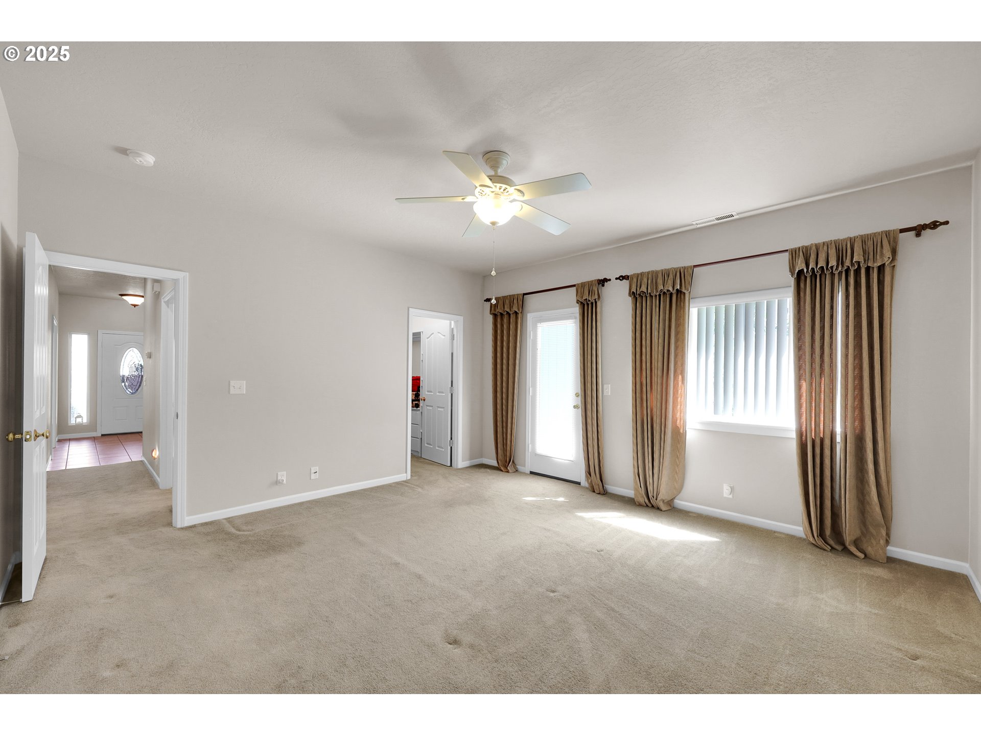 88075 9th Street Veneta, OR 97487 - Photo 24 of 45 a view of a livingroom with a ceiling fan and window