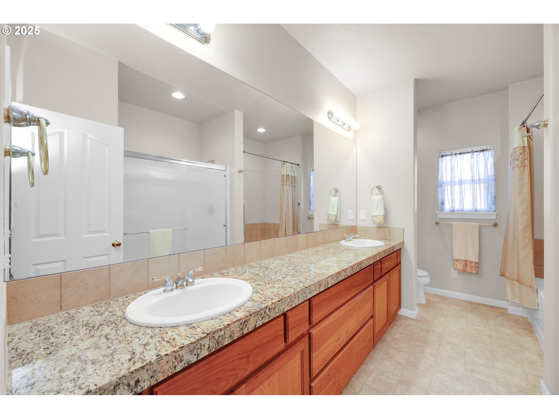 88075 9th Street Veneta, OR 97487 - Photo 26 of 45 a bathroom with a granite countertop sink and a mirror