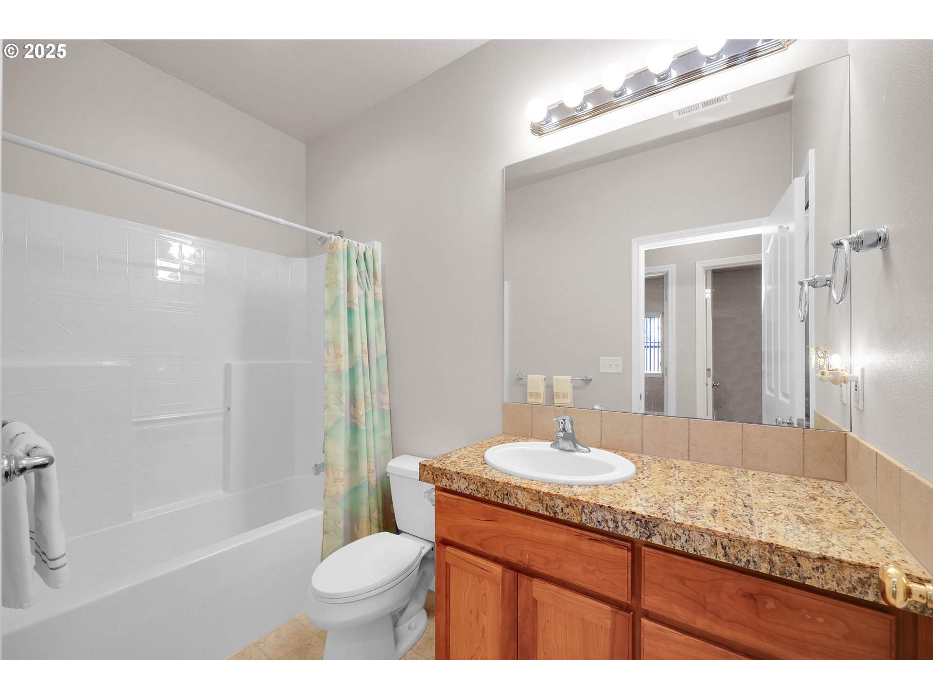 88075 9th Street Veneta, OR 97487 - Photo 32 of 45 a bathroom with a granite countertop sink toilet a mirror and shower