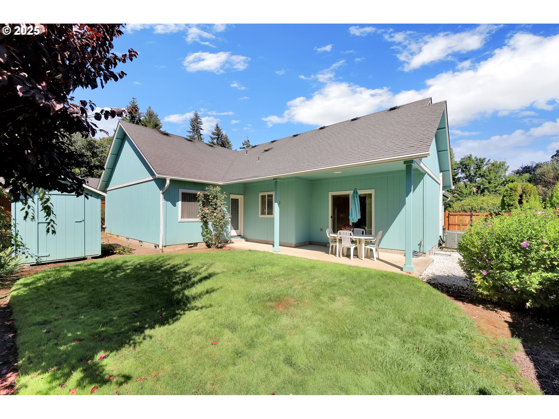 88075 9th Street Veneta, OR 97487 - Photo 36 of 45 a front view of a house with a garden and yard