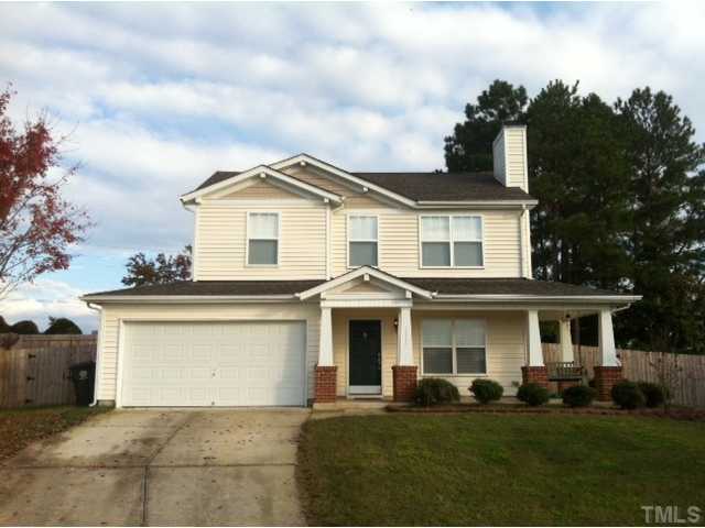 3632 Hamilton Mill Drive Raleigh, NC 27616 - Photo 1 of 12 a front view of a house with a garden