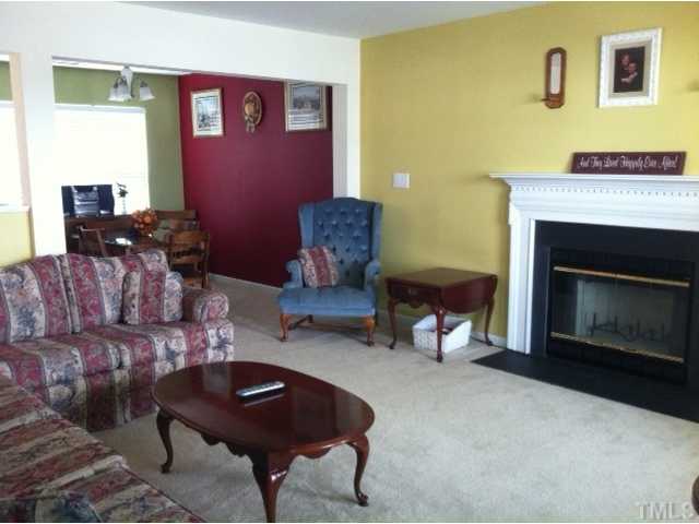 3632 Hamilton Mill Drive Raleigh, NC 27616 - Photo 2 of 12 a living room with furniture and a fireplace