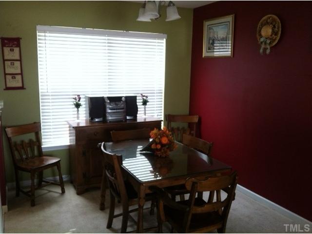 3632 Hamilton Mill Drive Raleigh, NC 27616 - Photo 3 of 12 a view of a dining room with furniture and a window