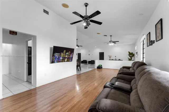 a bathroom with a sink mirror and vanity