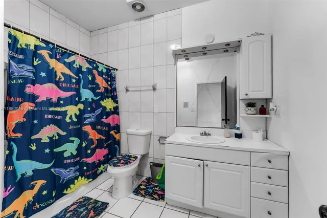 a living room with a bed furniture and a window