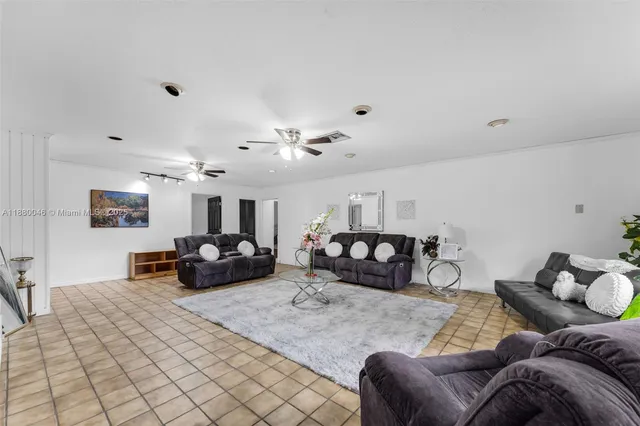 a bedroom with furniture and wooden floor