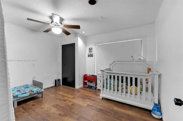 a bedroom with furniture and a book shelf