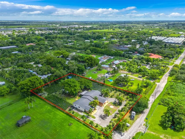 a view of a street with a building in the background