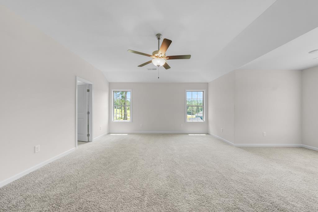 623 Bohannon Road Grantville, GA 30220 - Photo 20 of 34 an empty room with ceiling fan and window