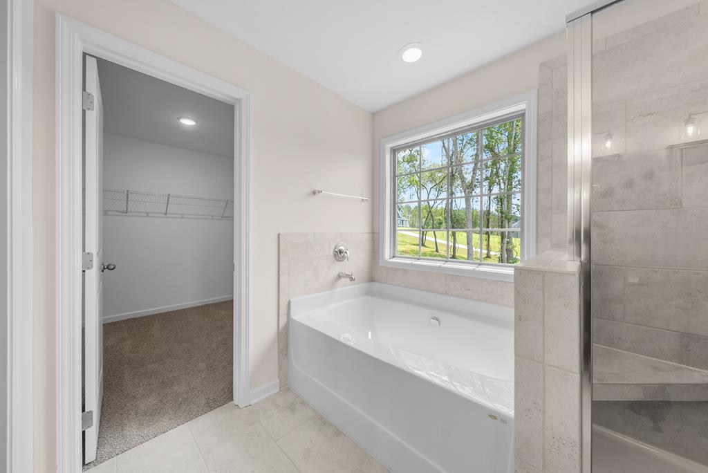 623 Bohannon Road Grantville, GA 30220 - Photo 22 of 34 a spacious bathroom with a tub shower and sink