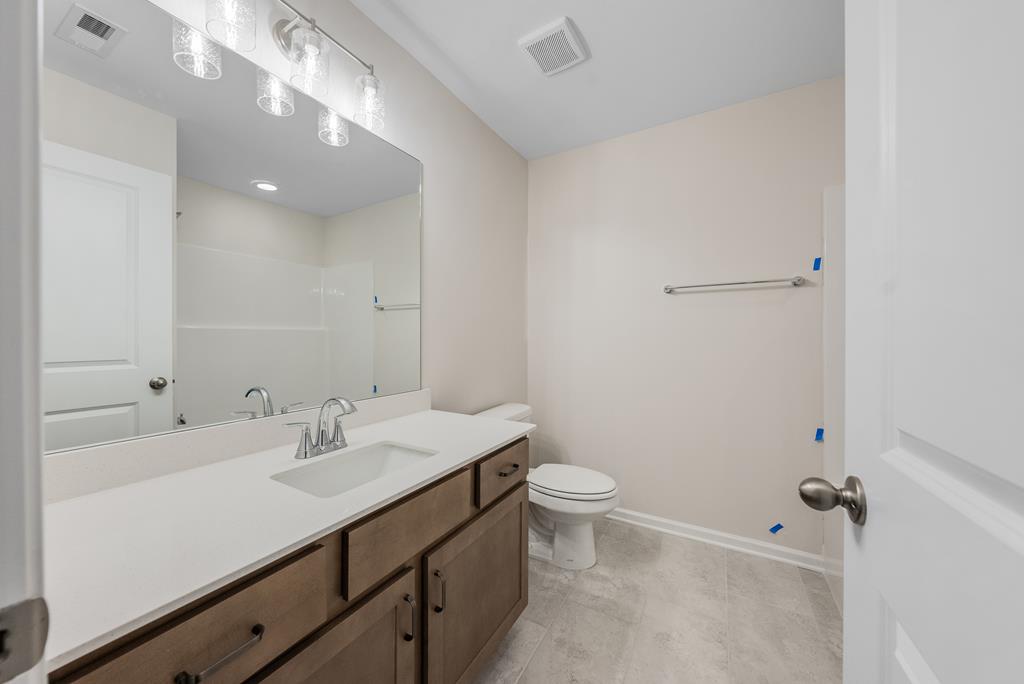 623 Bohannon Road Grantville, GA 30220 - Photo 31 of 34 a bathroom with a sink a toilet and shower