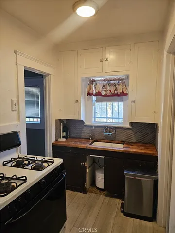 a kitchen with a stove and a sink