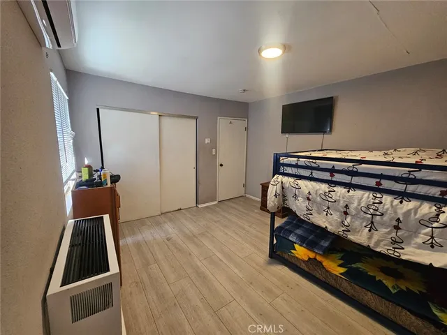 a view of a room with wooden floor