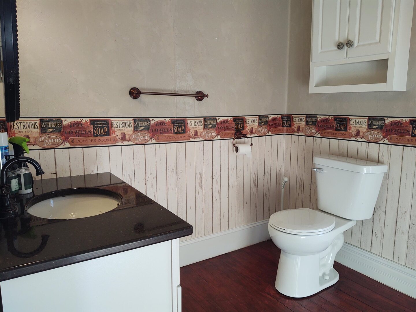 603 North 5th Street Vienna, IL 62995 - Photo 17 of 24 a bathroom with a granite countertop sink and a toilet