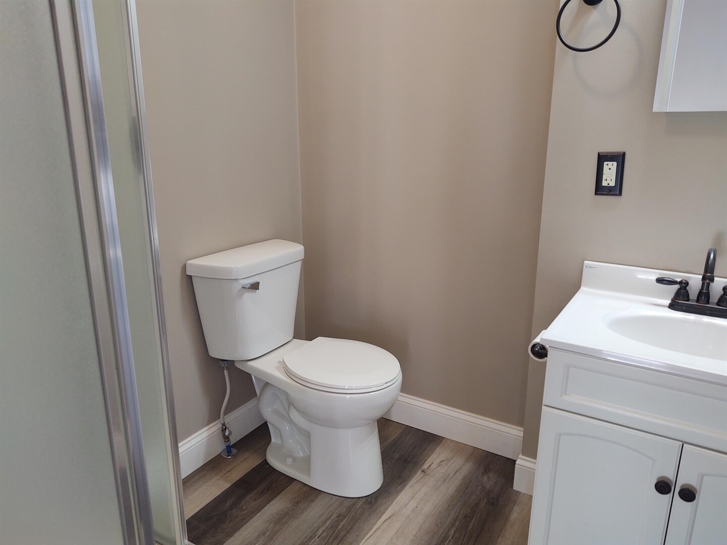 603 North 5th Street Vienna, IL 62995 - Photo 10 of 24 a white toilet sitting next to a sink