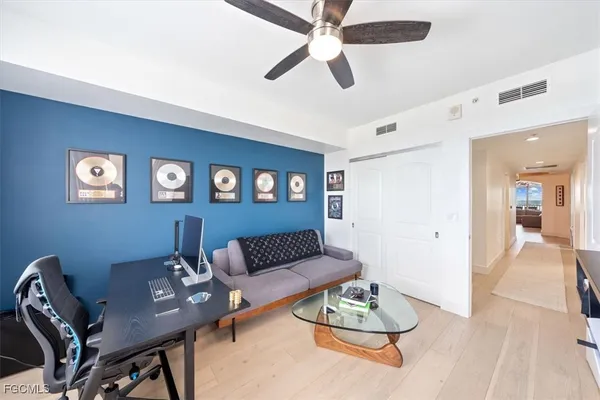 a living room with furniture fireplace and a flat screen tv