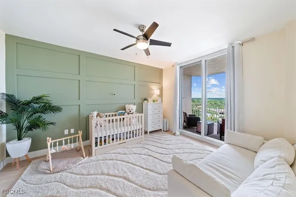 a bathroom with a sink a toilet and a large mirror