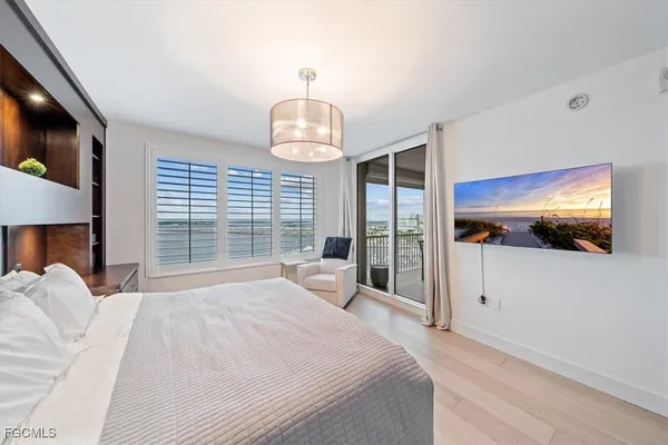 a view of living room with furniture and a chandelier