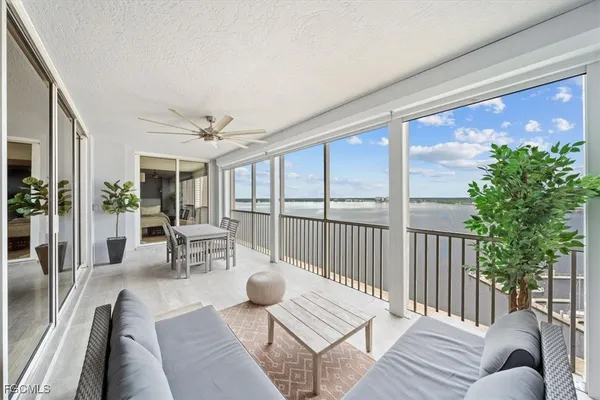 a view of a roof deck with furniture and wooden floor