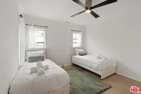 a bedroom with a bed and window