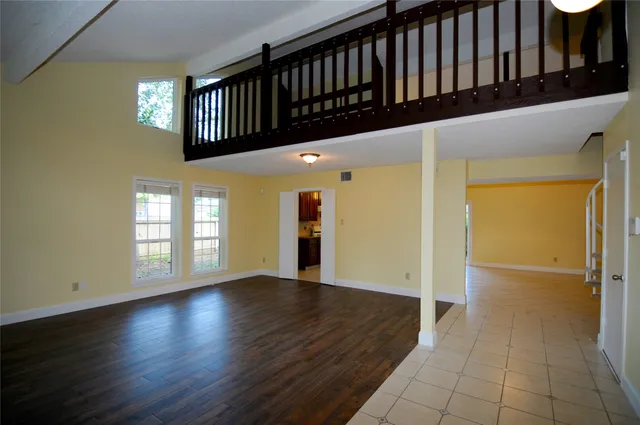 a view of entryway with stairs and wooden floor