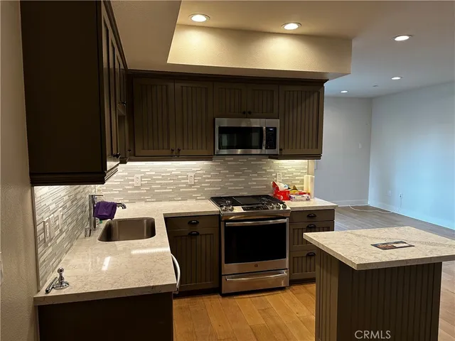 a kitchen with a stove and a sink