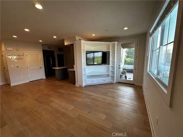 a view of livingroom with furniture wooden floor and window