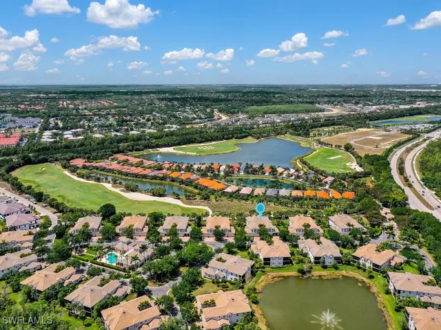 an aerial view of residential houses with outdoor space