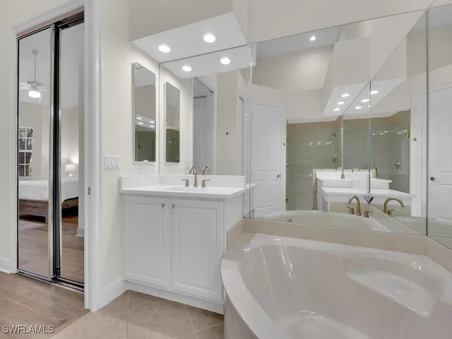 a bathroom with a double vanity sink mirror and double