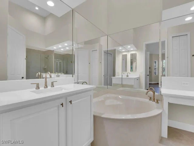 a bathroom with a sink double vanity and a mirror