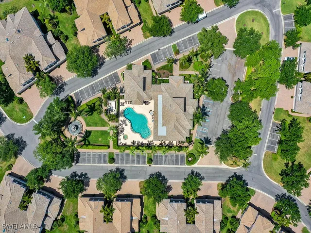 an aerial view of residential house with outdoor space and swimming pool