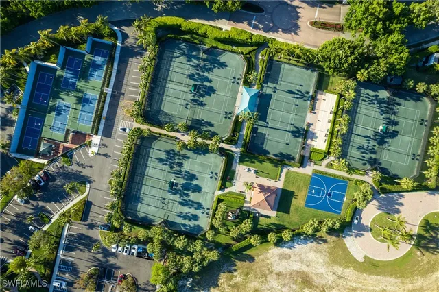 an aerial view of residential house with outdoor space and swimming pool
