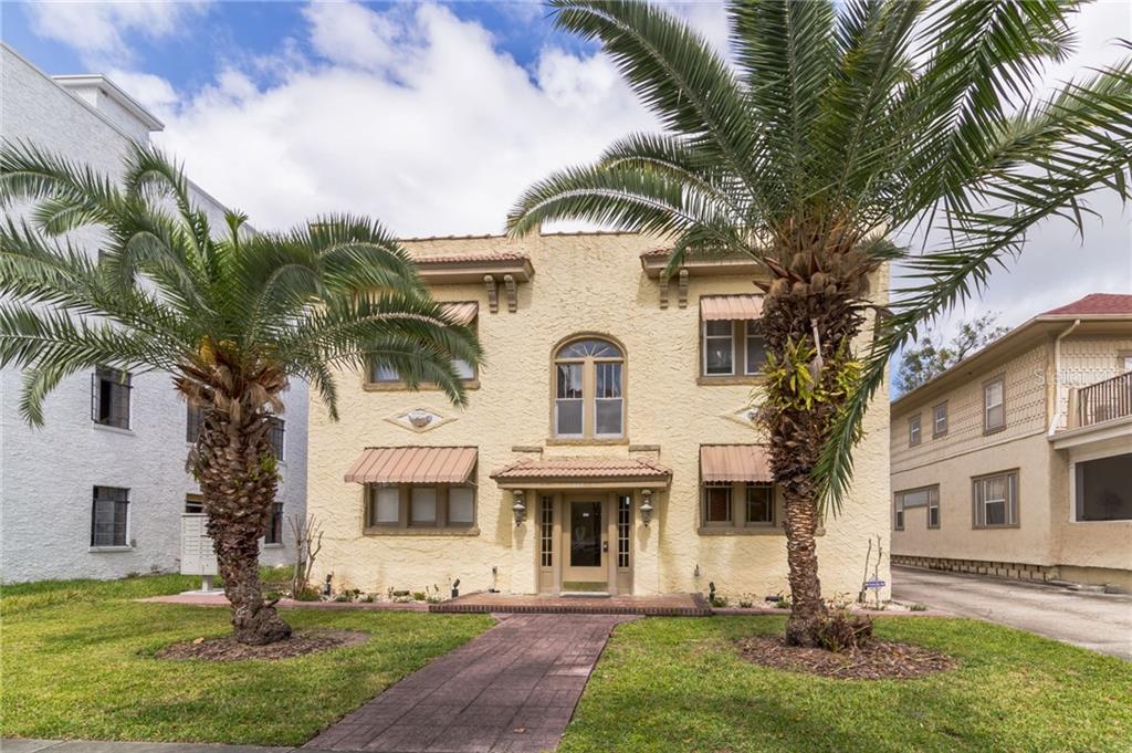 613 East Ridgewood Street, Unit 1 Orlando, FL 32803 - Photo 1 of 1 a front view of a house with garden