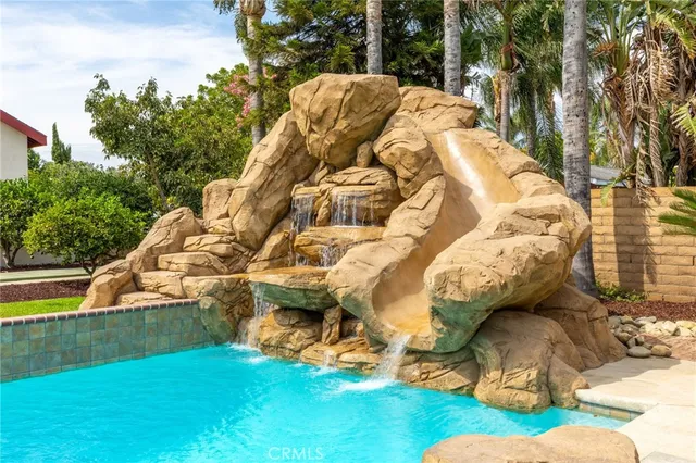a living room with furniture potted plant and a window