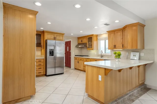 a spacious bathroom with a double vanity sink and a mirror