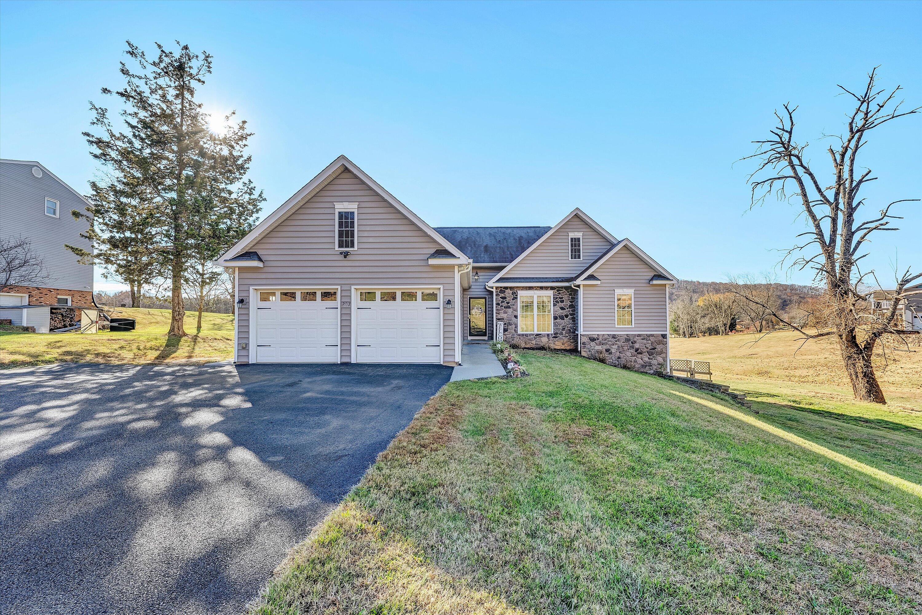 207 Overlook Road Vinton, VA 24179 - Photo 2 of 65 a front view of a house with a yard and garage