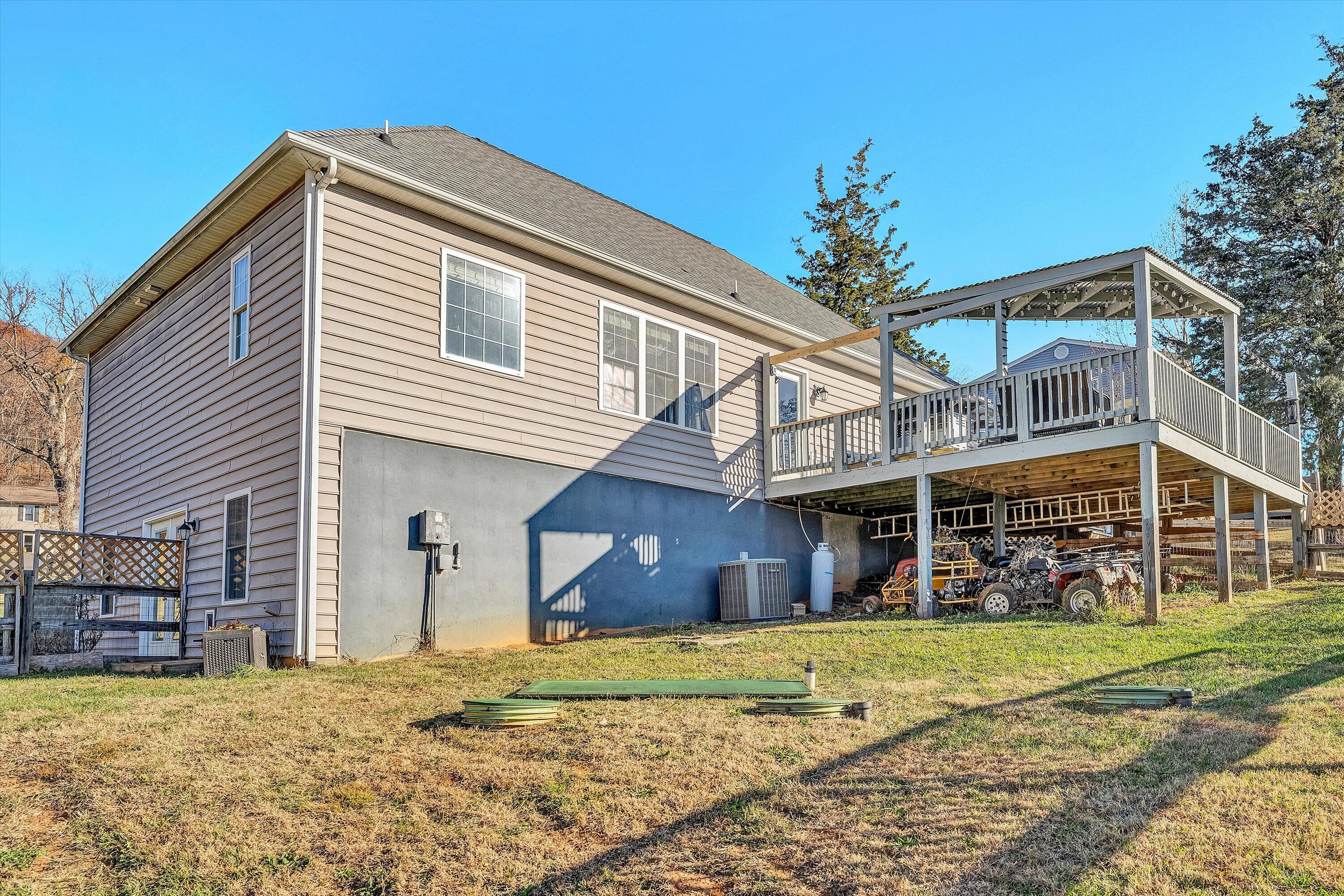 207 Overlook Road Vinton, VA 24179 - Photo 56 of 65 a view of a house with a swimming pool and a yard