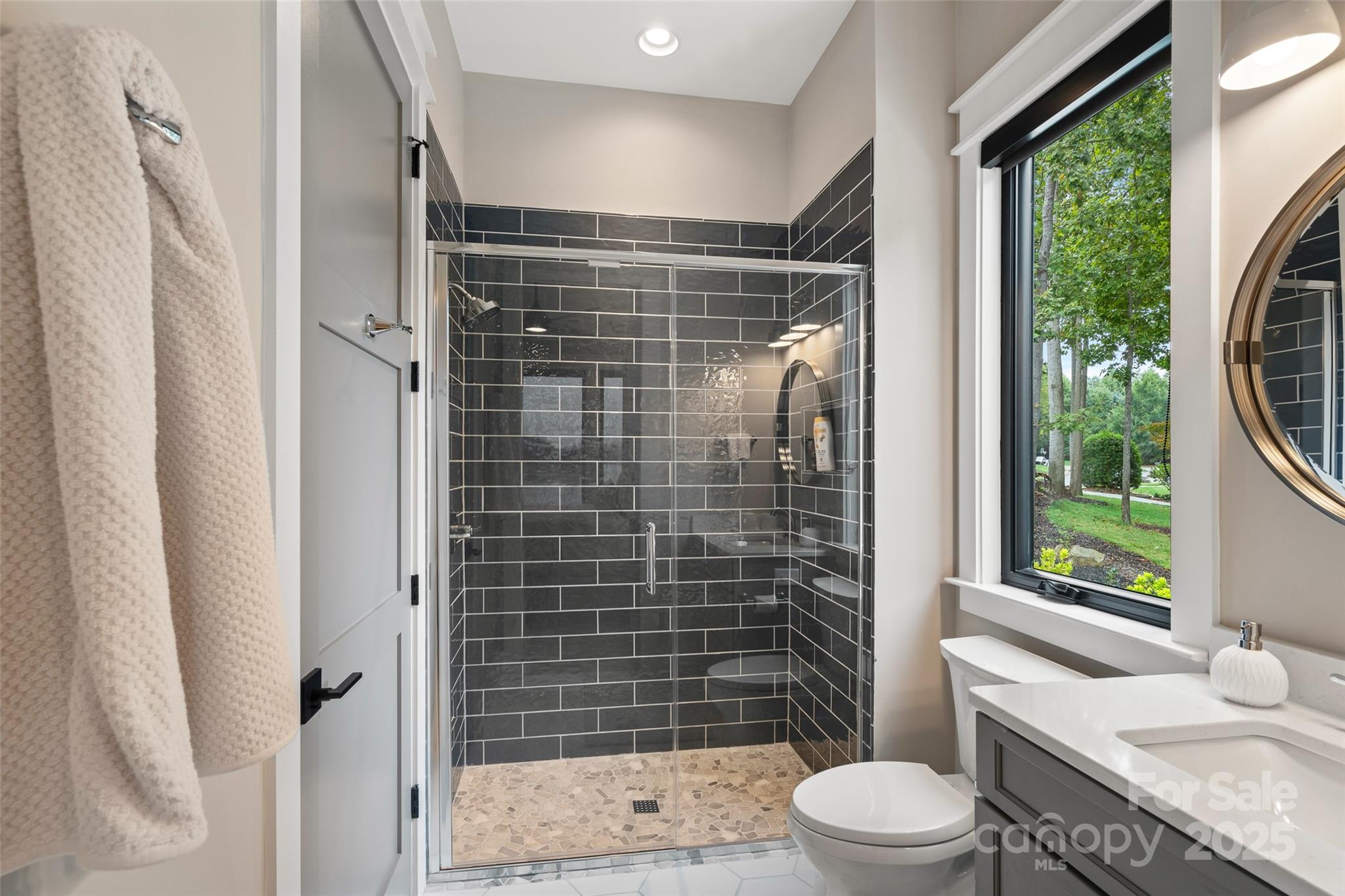 505 Kemp Road Mooresville, NC 28117 - Photo 14 of 38 a bathroom with a shower toilet and sink